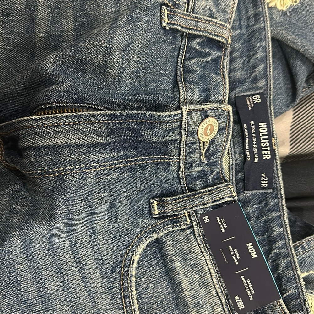 Never worn with tags still in place. A little wrinkled from packaging.